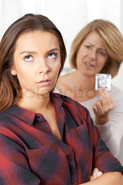 Mother Talking To Teenage Daughter About Contraception Stock Image