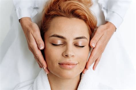 Premium Photo Top View Of Relaxed Woman Laying With Closed Eyes During Anti Aging Facial