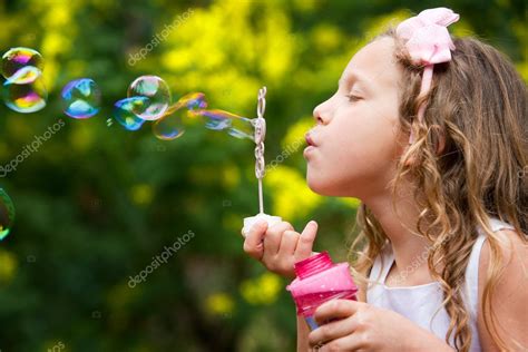 Young Girl Blowing Bubbles — Stock Photo © Karelnoppe 9394379