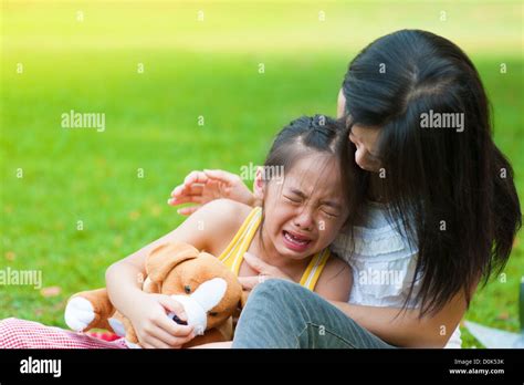 Mother Is Comforting Her Crying Daughter Stock Photo Alamy