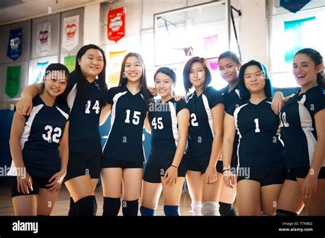 Portrait Of Teenage Girls Volleyball Team At Court Stock Photo Alamy