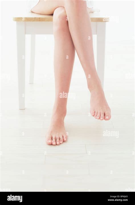 Woman Crossing Legs Stock Photo Alamy
