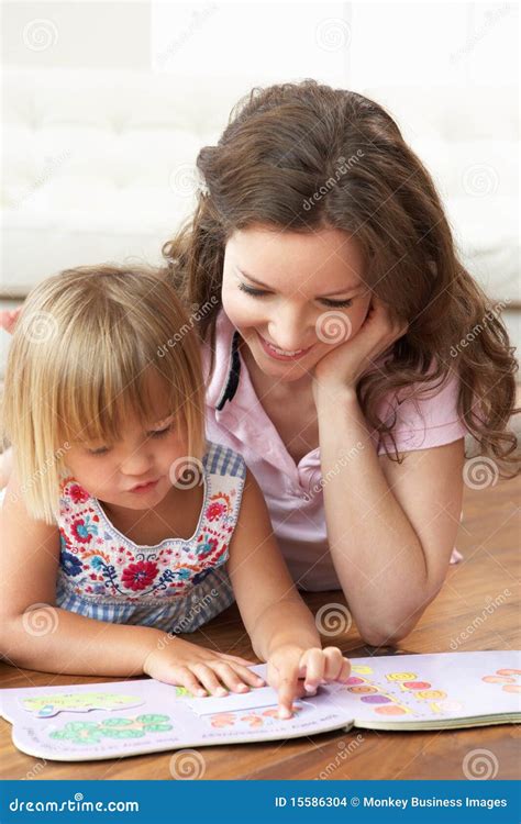 Mother And Daughter Learning To Read At Home Stock Photo Image Of