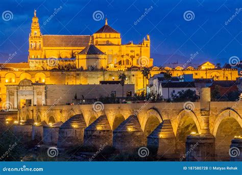 Evening View Of The Mosque Cathedral And Roman Bridge In Cordoba Spa