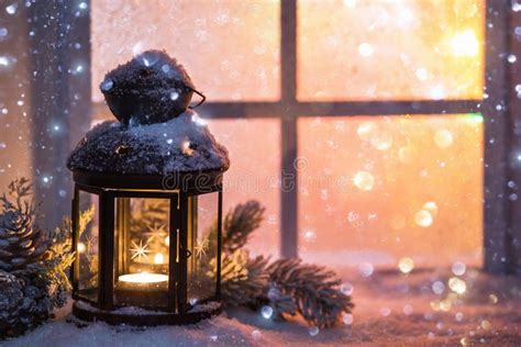 Winter Decoration With A Candlestick Near The Snow Covered Window Stock