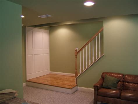 Stair walls are commonly used to decorate with family photo frames and spot lights to highlight them. Upper Marlboro Basement