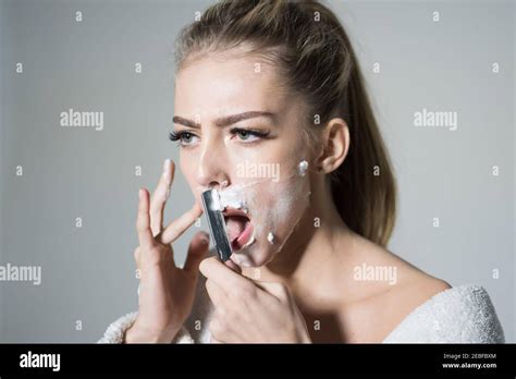 girl moustache barber and shaving concept woman with face covered with foam holds straight