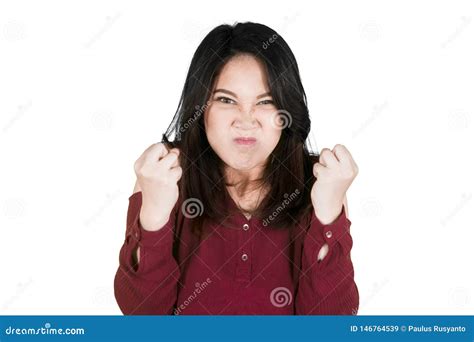 Woman Clenching Fists Measuring On Weighing Scale Royalty Free Stock