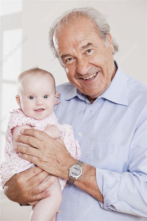 Grandpa Holding A Baby Stock Image F003 6433 Science Photo Library