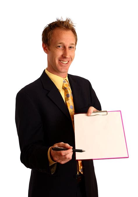 Clipboard Free Stock Photo A Young Businessman In A Suit Holding A