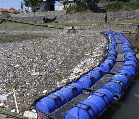 Sungai Watch Installs Momentous 100th Trash Barrier Protecting Balis