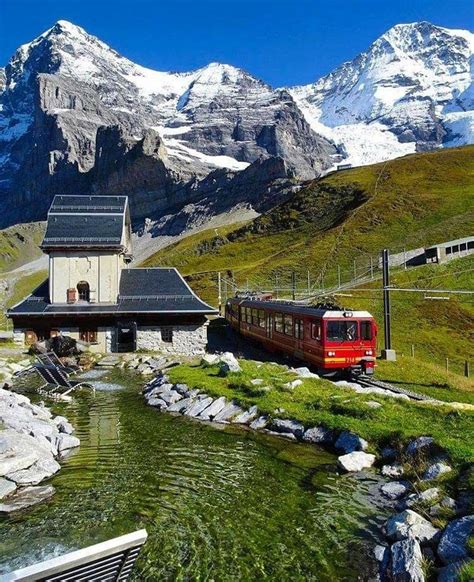 A Train Heading Into The Swiss Alps Switzerland Switzerland Alps
