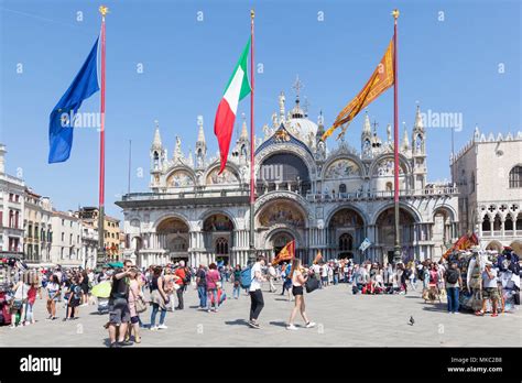 Basilica San Marco St Marks Cathedral In Piazza San Marco St Marks Square With The Flags Of