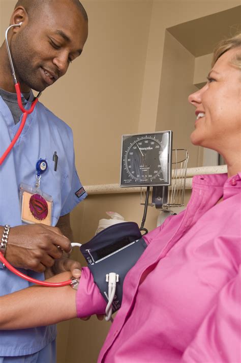 Blood Pressure Free Stock Photo A Male Nurse Taking The Blood