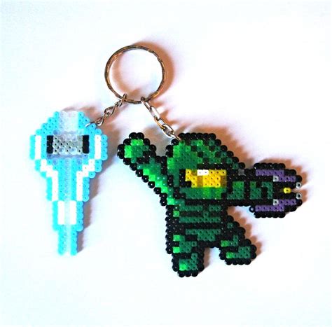 An Image Of A Pixel Keychain That Is Made To Look Like A Creature