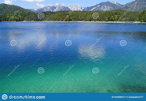 Picturesque Turquois Alpine Lake Eibsee By Foot Of Mountain Zugspitze