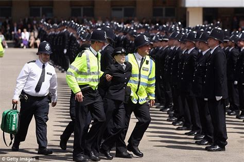 rookie police officers drop like flies as they stand to attention at passing out parade daily