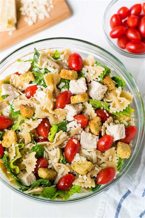 Add in the spinach and the halved cherry tomatoes. Chicken Caesar Pasta Salad | Well Plated by Erin