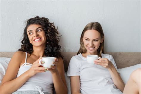 Happy Lesbian Couple Holding Cups Of Stock Image Image Of Lesbian Coffee 236040225