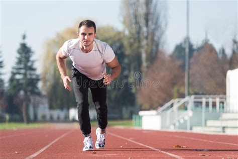 Athlete Man Sprinting On The Running Track Stock Photo Image Of Line