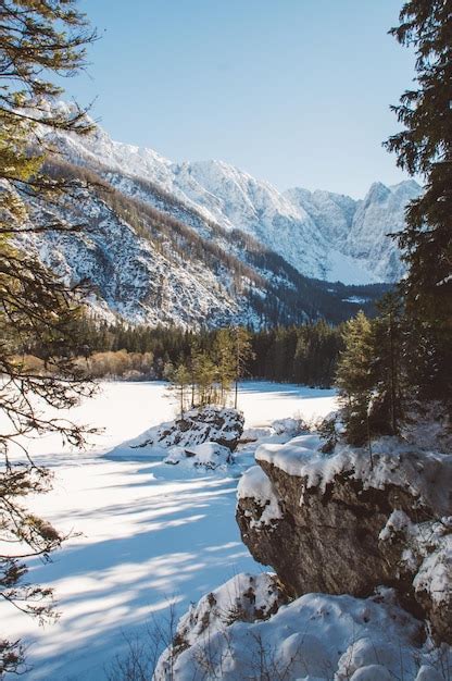 Premium Photo Snow Coverd Lake And Mountains Laghi Di Fusine In Winter