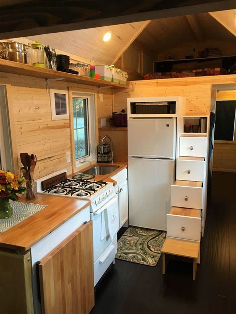 Despite its small footprint, it has three bedrooms, two bathrooms, and an open plan living space, complete with an invisible kitchen so the room can switch from cooking area to lounge area just by sliding the doors. Tiny House Kitchen | Tiny house kitchen, House design ...