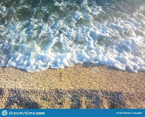 Sea Waves And Yellow Sand In The Late Afternoon Stock Photo Image Of