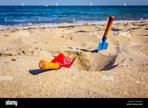 Small Spade And Shovel For Digging Sand On The Beach Stock Photo Alamy