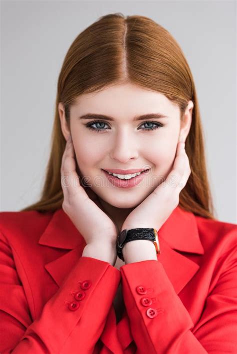 Portrait Of Smiling Young Female Model With Wristwatch Stock Photo