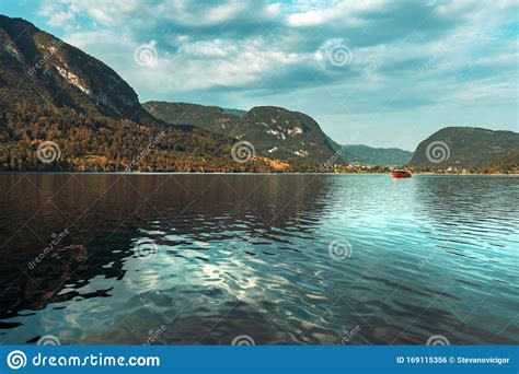 Lake Bohinj And Surrounding Mountain Landscape In Summer Stock Photo