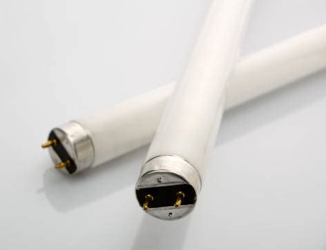 Old and new light bulbs. Changing fluorescent light tube is quick, inexpensive fix ...