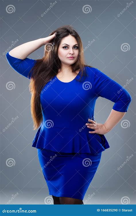 Plus Size Model In Blue Dress Fat Woman With Long Hair On Gray Background Body Positive