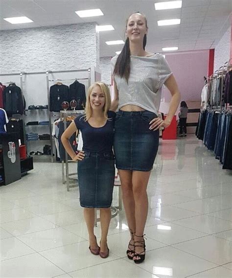 Two Women Standing Next To Each Other In A Clothing Store