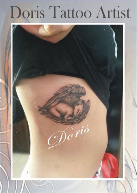 a woman s stomach with the words doris tattoo artist written in white on it