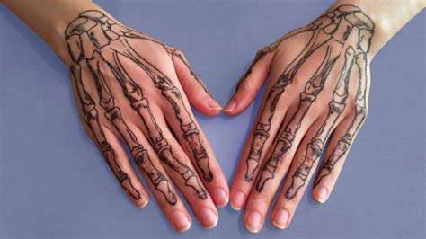 20 Skeleton Hand Tattoos That Are Terrifying And Cool Skeleton Hand
