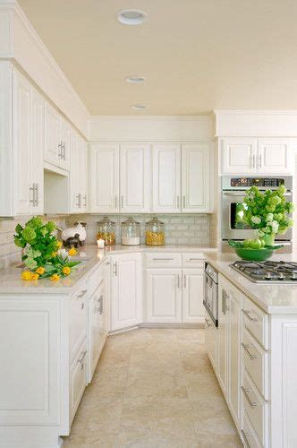 Do you assume kitchen floor tile ideas with white cabinets appears nice? Kitchen with white cabinets and travertine tile floor ...