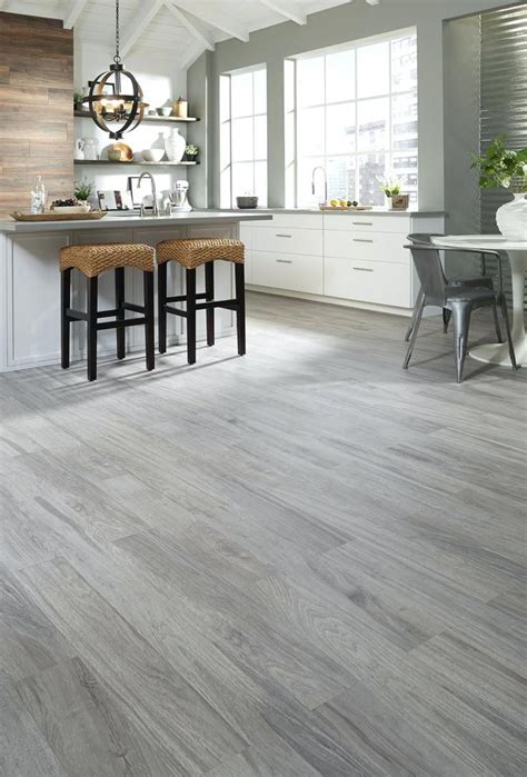 Home to any budget, home to any possibility. light gray wood floors fer paint with dark grey walls ...