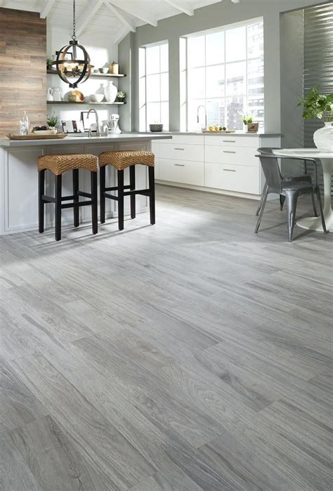 Grey floors add a light elegance to a home. light gray wood floors fer paint with dark grey walls ...
