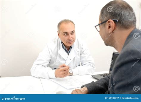 Doctor Urologist Advises A Male Patient In Clinic Stock Image Image