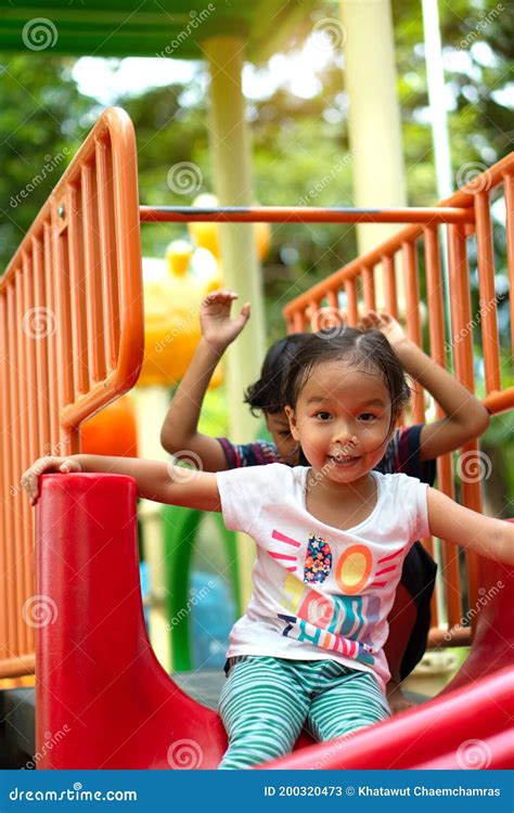 Asian Girl Is Enjoy On A Playground Equipment In A School Stock Image Image Of Park Little