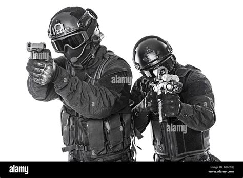 Studio Shot Of Swat Police Special Forces Black Uniforms Aiming