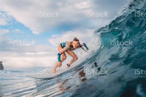 Beautiful Surfer Girl On Surfboard Woman In Ocean During Surfing Surfer
