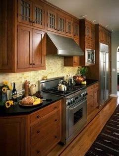 Our realtor has suggested that we not replace our white. What color wood floor goes with auburn maple cabinets