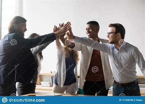 Excited Successful Diverse Business People Giving High Five