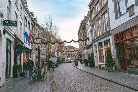 Busy Street With Shops And Homes In Wyck Neighborhood Of Maastricht