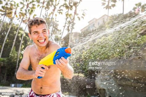 man squirt gun photos and premium high res pictures getty images