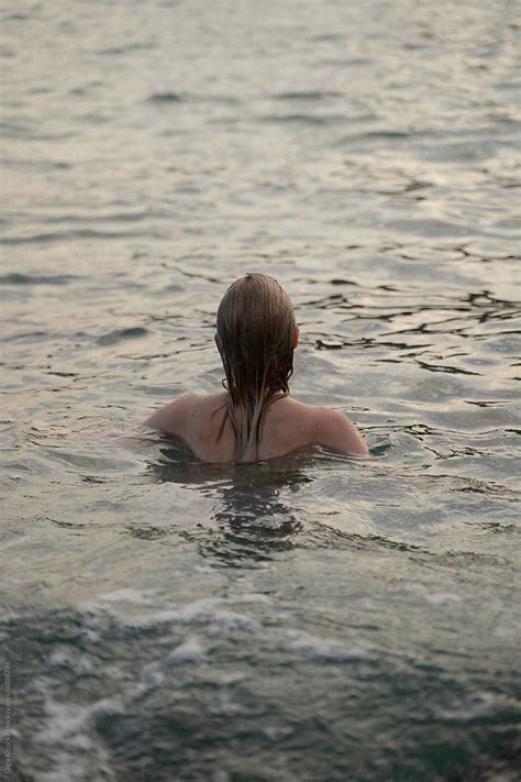 Woman Swimming Naked In The Sea Del Colaborador De Stocksy Olga