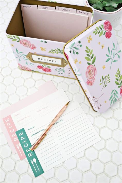 A Pink And Green Flowered Box Sitting On Top Of A Table Next To A