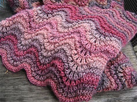 The feather and fan stitch is a classic lace knitting pattern. Ravelry: Feather and Fan Stitch, or Old Shale pattern by ...