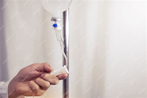 Premium Photo Doctor Adjusted Volume Rate Of Saline Iv Drip Infusion